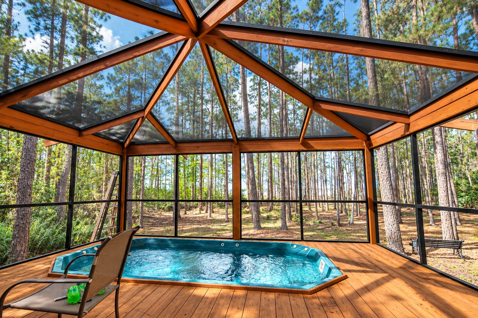 A screened patio enclosure with a timber frame and clear roof surrounds a small pool, with pine trees visible outside.